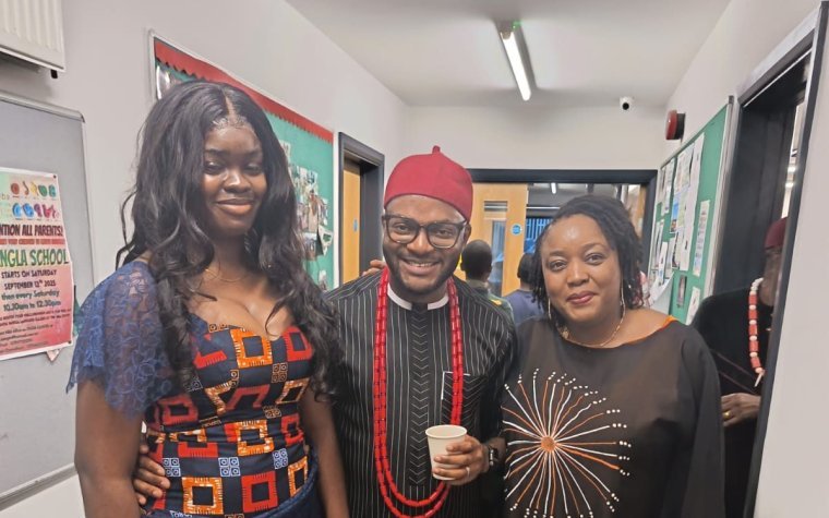 Igbo Union Northamptonshire - Three members in Igbo dress standing together indoors