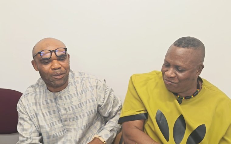 Igbo Union Northamptonshire - Two members seated side by side at a gathering
