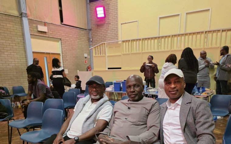 Igbo Union Northamptonshire - Members seated together in a hall during an event