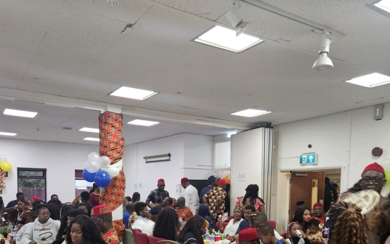 Igbo Union Northamptonshire - A hall full of members seated at tables during a community celebration