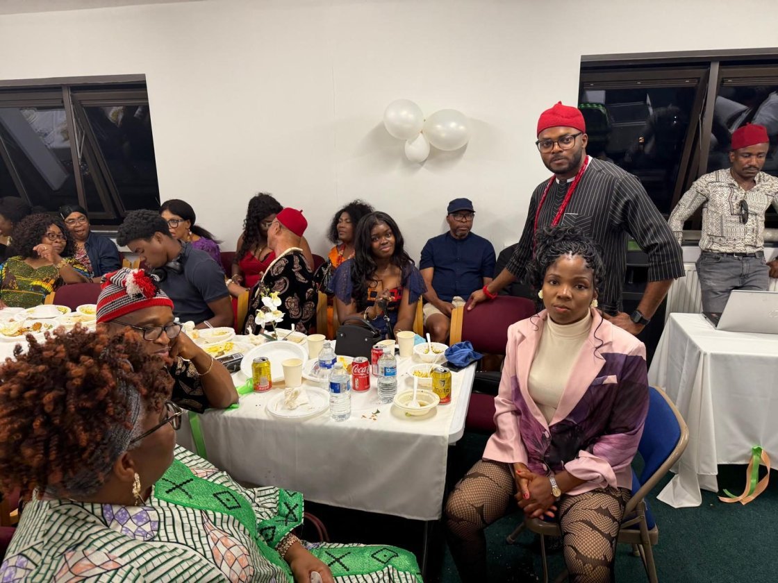 Igbo Union Northamptonshire - Members seated at decorated tables in a hall during a community gathering